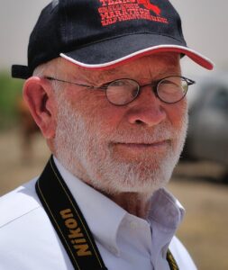 An image showing Jim Harris wearing a hat and glasses.